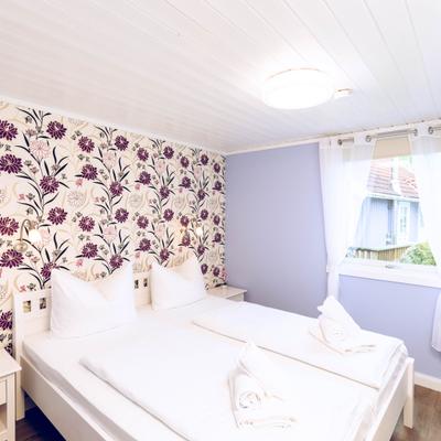 Das Schlafzimmer im skandinavischen Ferienhaus